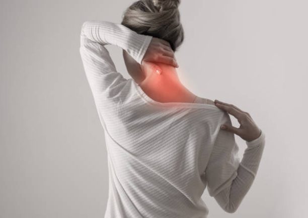 Woman suffering from back and neck pain. Chiropractic, Physiotherapy concept Woman suffering from back and neck pain. Chiropractic, Physiotherapy concept